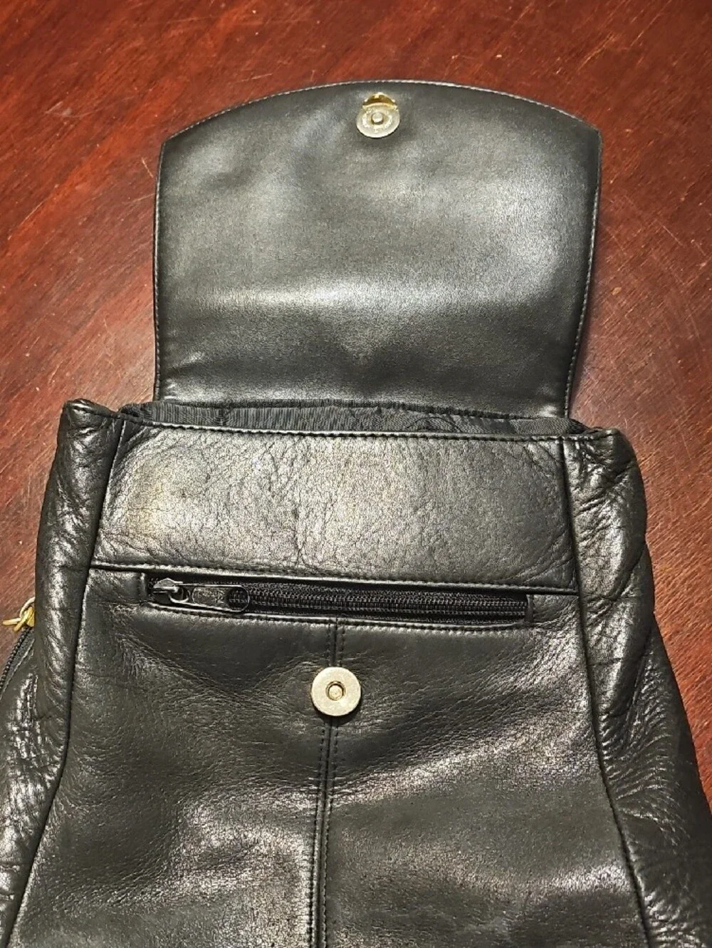 Tignanello Black Leather Backpack with Gold Hardware